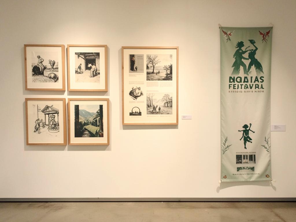Gallery wall with artwork and festival banner